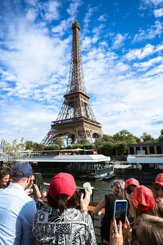 The Eiffel Tower from the deck, guests in the foreground