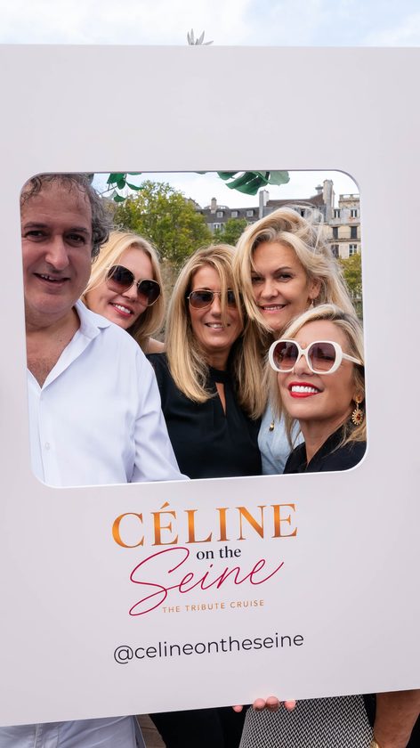 Guests posing in the Céline on the Seine photo frame